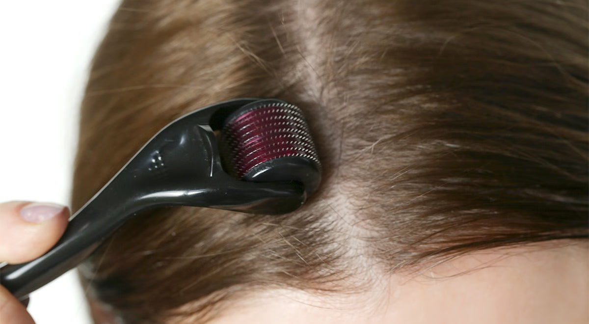 Woman using Hair Co. Scalp Dermaroller with Growth Booster Hair Oil for thicker and healthier hair
